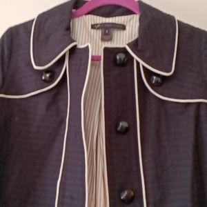 Black coat with white trim